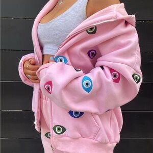 Trendy Pink Hoodie with Eye Design